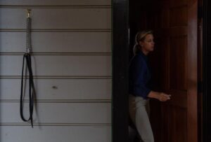 Woman walking out of barn