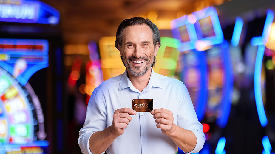 Man holding FastTrack card