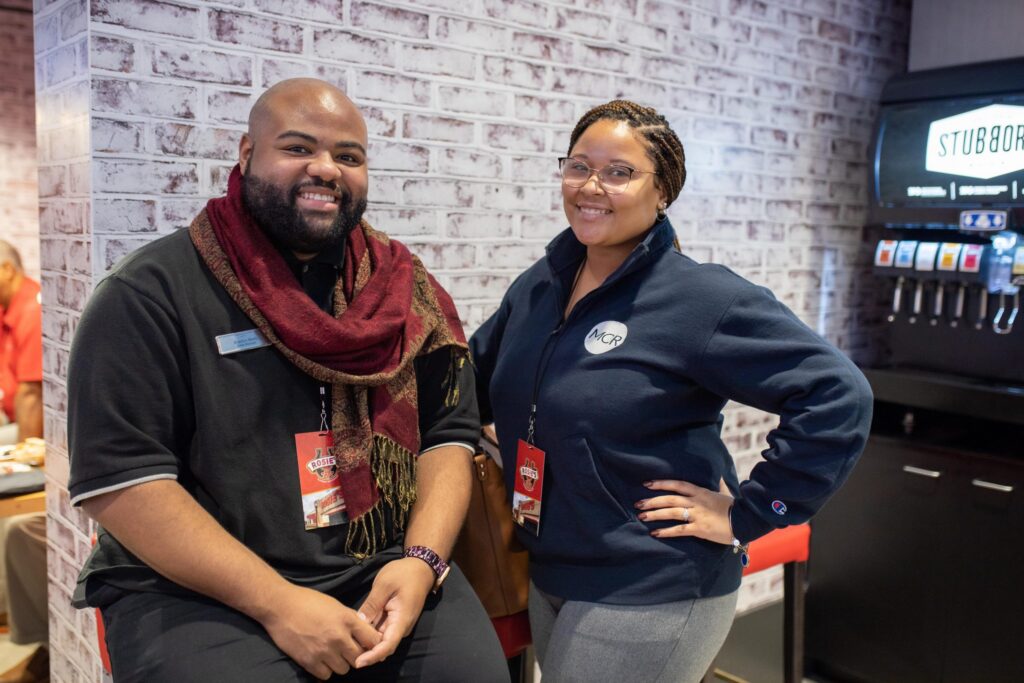 two rosies workers smiling